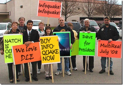 Picketers with 'Infoquake' signs
